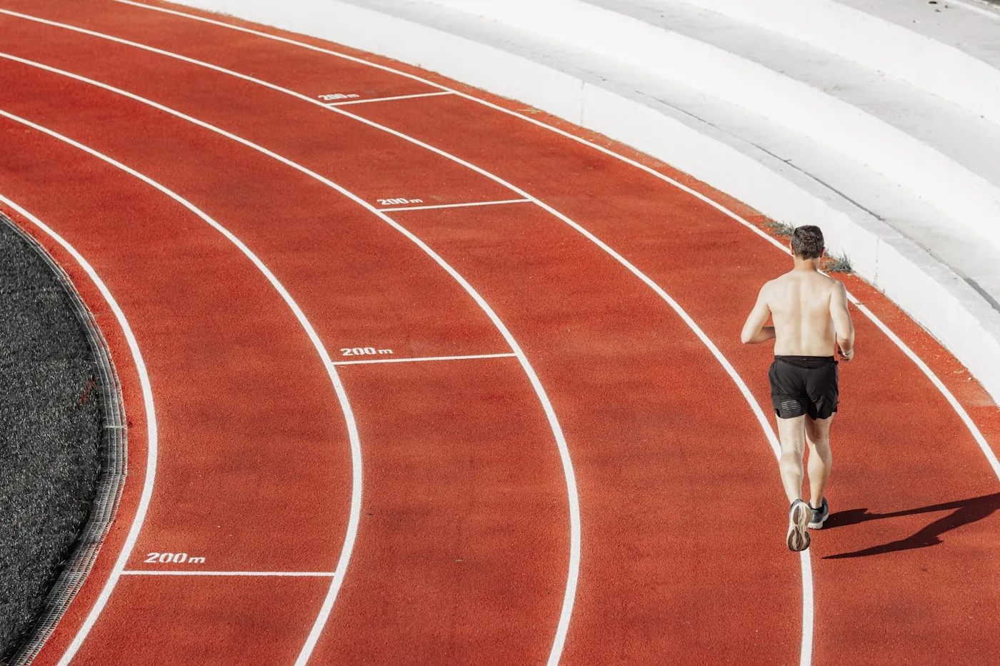 Runner training on an outdoor track